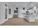 Spacious eat-in kitchen with a large island, modern appliances, and sleek white cabinetry at 10801 Clarion Ln, Las Vegas, NV 89134