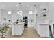 Contemporary kitchen with white cabinetry, an island with seating, and modern appliances at 10801 Clarion Ln, Las Vegas, NV 89134