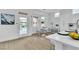 Eat-in kitchen with white cabinets, stainless appliances, and outdoor access at 10801 Clarion Ln, Las Vegas, NV 89134