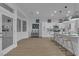 Bright kitchen space with island, bar seating, and modern finishes at 10801 Clarion Ln, Las Vegas, NV 89134