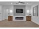 Living room features an electric fireplace and entertainment center at 10801 Clarion Ln, Las Vegas, NV 89134