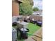 Cozy backyard with artificial turf, patio area, desert landscaping, and comfortable seating at 111 E Van Wagenen St, Henderson, NV 89015