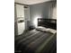 Comfortable bedroom featuring modern wardrobe and neutral decor at 111 E Van Wagenen St, Henderson, NV 89015