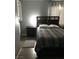 Cozy bedroom with stylish furniture, including a bed and nightstands at 111 E Van Wagenen St, Henderson, NV 89015