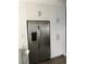 Modern kitchen with stainless steel refrigerator and white cabinetry at 111 E Van Wagenen St, Henderson, NV 89015