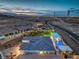 Expansive property showcasing an outdoor pool, covered patio, and manicured landscaping with city views at 11238 Rebel Dome Ct, Las Vegas, NV 89141