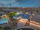 Expansive estate with a three-car garage, lush lawn, sparkling pool, and stunning city views in the background at 11238 Rebel Dome Ct, Las Vegas, NV 89141