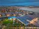 Aerial view of a luxury home featuring a pool, putting green, and outdoor living spaces in the community at 11238 Rebel Dome Ct, Las Vegas, NV 89141