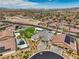 Overhead view shows a home with a beautiful pool, putting green, and landscaped backyard at 11238 Rebel Dome Ct, Las Vegas, NV 89141