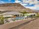 Aerial view showcases a private backyard oasis with a sparkling pool and mountain backdrop at 11238 Rebel Dome Ct, Las Vegas, NV 89141