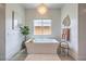 Serene bathroom featuring a modern soaking tub, stylish fixtures, and minimalist decor for a relaxing spa-like experience at 11238 Rebel Dome Ct, Las Vegas, NV 89141