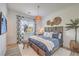 Comfortable bedroom featuring a large bed, decorative curtains, and a cozy rug, creating a relaxing atmosphere at 11238 Rebel Dome Ct, Las Vegas, NV 89141