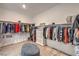 Spacious walk-in closet with built-in shelving and hanging rods provides ample storage for clothing and accessories at 11238 Rebel Dome Ct, Las Vegas, NV 89141