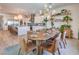 Open concept: dining area next to kitchen, with modern light fixture and plant accents at 11238 Rebel Dome Ct, Las Vegas, NV 89141