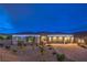 Charming single-story home featuring a three-car garage and a meticulously landscaped front yard at 11238 Rebel Dome Ct, Las Vegas, NV 89141
