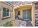A charming front entrance features a double door, brick accents, and lush landscaping at 11238 Rebel Dome Ct, Las Vegas, NV 89141