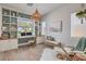 Bright home office featuring custom built-in shelving, a large window with lots of natural light, and coastal accents at 11238 Rebel Dome Ct, Las Vegas, NV 89141