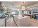Modern kitchen with large center island, open to dining and living spaces for easy entertaining at 11238 Rebel Dome Ct, Las Vegas, NV 89141
