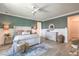 Comfortable bedroom features accent wall, decorative lighting, and stylish furniture at 11238 Rebel Dome Ct, Las Vegas, NV 89141
