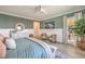 Relaxing bedroom includes comfortable seating, stylish decor, and access to outdoor patio at 11238 Rebel Dome Ct, Las Vegas, NV 89141