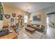 Inviting home office features a desk, sofa, and sports memorabilia on the wall at 11238 Rebel Dome Ct, Las Vegas, NV 89141