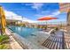 Inviting pool with lounge chairs and beautiful desert views beyond the fence at 11238 Rebel Dome Ct, Las Vegas, NV 89141