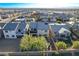Aerial view showcasing a home with a well-maintained yard in a developed suburban neighborhood at 1610 Dire Wolf Avenue, North Las Vegas, NV 89084