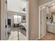 Bedroom viewed through an entryway featuring a bed, desk, and neutral color scheme at 1610 Dire Wolf Avenue, North Las Vegas, NV 89084
