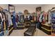 Walk-in closet featuring ample storage, clothing racks, and athletic memorabilia at 1610 Dire Wolf Avenue, North Las Vegas, NV 89084