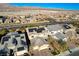 An aerial view of a neighborhood showcasing modern homes and well-maintained streets at 1610 Dire Wolf Avenue, North Las Vegas, NV 89084