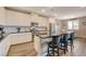 Well-appointed kitchen with white cabinetry, a granite island, and stainless steel appliances at 1610 Dire Wolf Avenue, North Las Vegas, NV 89084