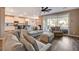 Bright and airy living room with a view of the backyard and an open layout to the kitchen at 1610 Dire Wolf Avenue, North Las Vegas, NV 89084