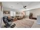Comfortable living room featuring a plush rug, stylish seating, and a cozy atmosphere, ideal for relaxation at 1610 Dire Wolf Avenue, North Las Vegas, NV 89084
