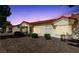 The back exterior of a single story home with desert landscaping, patio cover, and rock ground cover at 1904 Bellview St, Las Vegas, NV 89134