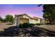 The back exterior of a single story home with desert landscaping, patio cover, and rock ground cover at 1904 Bellview St, Las Vegas, NV 89134