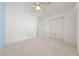 Bedroom with neutral carpet, white walls, and a ceiling fan at 1904 Bellview St, Las Vegas, NV 89134