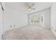 Bedroom featuring neutral carpet, bay window, and ceiling fan at 1904 Bellview St, Las Vegas, NV 89134