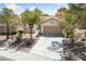 Charming single-story home featuring a well-maintained front yard and two-car garage at 1904 Bellview St, Las Vegas, NV 89134
