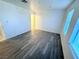 Bedroom featuring wood-look flooring, neutral walls, and bright window at 2064 Mesquite Ln # 102, Laughlin, NV 89029