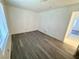 Empty bedroom showcasing wood-look floors, a window, and a doorway, providing a blank canvas at 2064 Mesquite Ln # 102, Laughlin, NV 89029