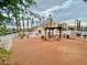 Community space featuring a pergola, pool, and landscaping, offering a relaxing area at 2064 Mesquite Ln # 102, Laughlin, NV 89029