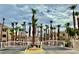 Community entrance featuring a gated entrance, beautiful landscaping, and palm trees at 2064 Mesquite Ln # 102, Laughlin, NV 89029