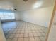 Bright living room with large window, tile floors, and neutral walls at 2064 Mesquite Ln # 102, Laughlin, NV 89029