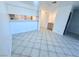 Open living space featuring tile flooring, light neutral walls, and a breakfast bar at 2064 Mesquite Ln # 102, Laughlin, NV 89029