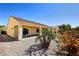 The backyard has a covered patio and desert landscaping at 2183 Waterton Rivers Dr, Henderson, NV 89044