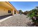 A covered patio complements the rock landscaping in the backyard at 2183 Waterton Rivers Dr, Henderson, NV 89044