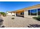Backyard featuring desert landscaping and a covered patio at 2183 Waterton Rivers Dr, Henderson, NV 89044
