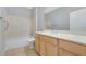 Clean bathroom featuring a tub, toilet, and sink with modern fixtures at 2183 Waterton Rivers Dr, Henderson, NV 89044
