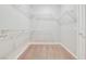 Walk-in closet with built-in shelving, offering ample storage space at 2183 Waterton Rivers Dr, Henderson, NV 89044