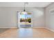 Dining area with tile floor and sliding glass door access to the backyard at 2183 Waterton Rivers Dr, Henderson, NV 89044